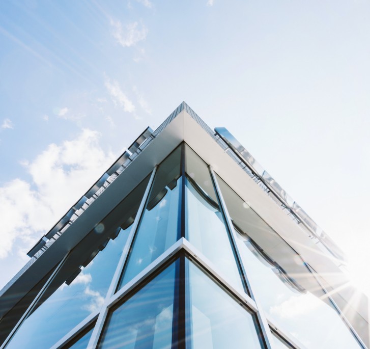 looking up at the corner of a commercial building